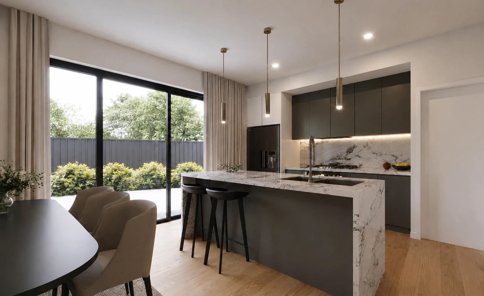 Open-plan kitchen and dining area opening to the garden through a full-height aluminium sliding door